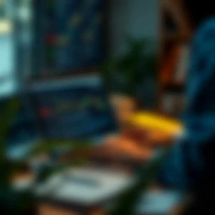 Person using a laptop to download and study trading books from an online resource